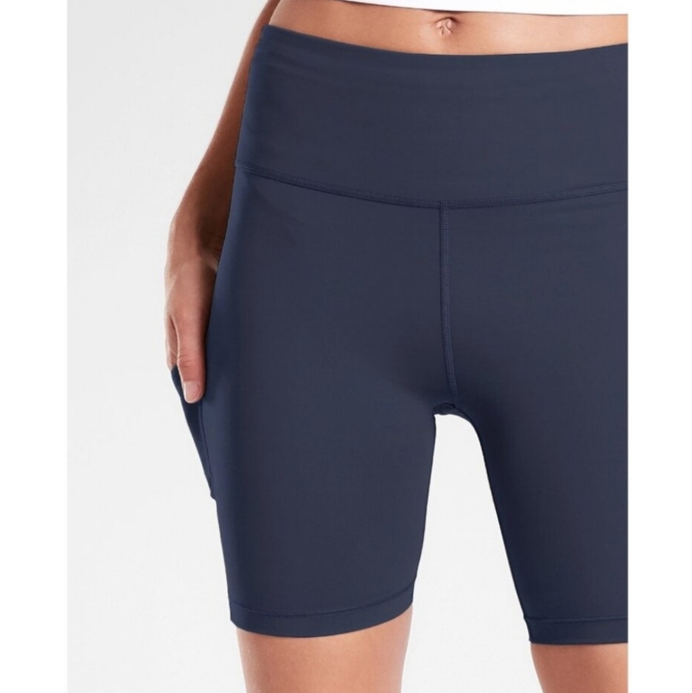 Athleta Ultimate Stash navy blue bike shorts. Medium, pockets, 7” inseam.
